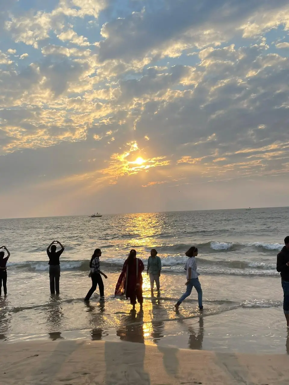 Beautiful beach sunset view with people enjoying trip by Kadam Tours and Travels