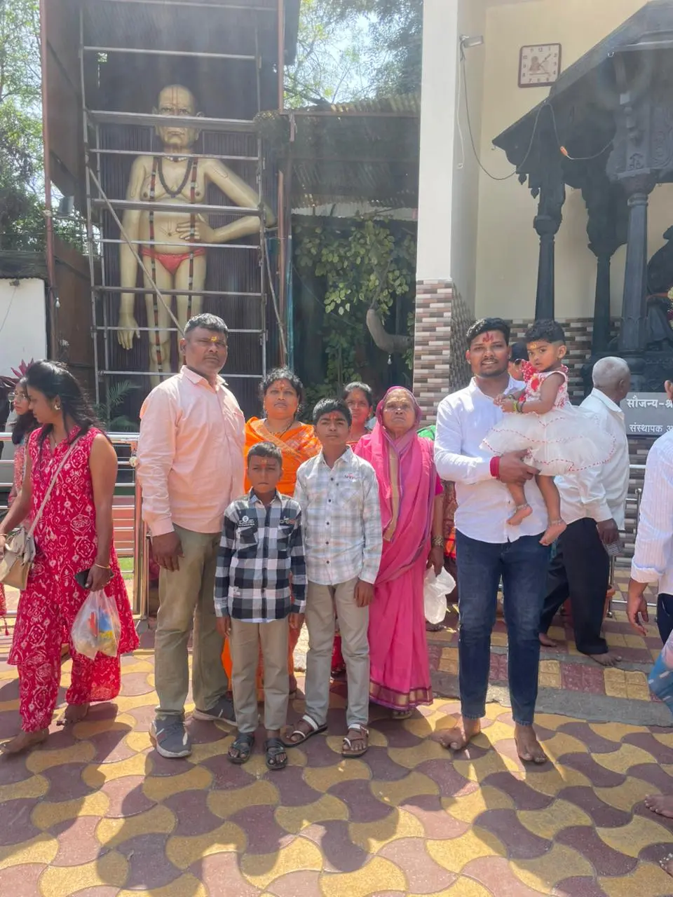 Family visiting temple near Pune with Kadam Tours and Travels cab service